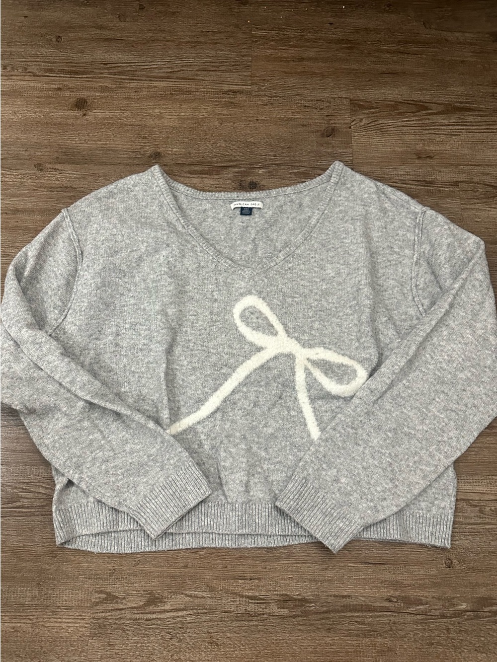 American Eagle Outfitters Light Gray V-Neck Sweater with White Bow